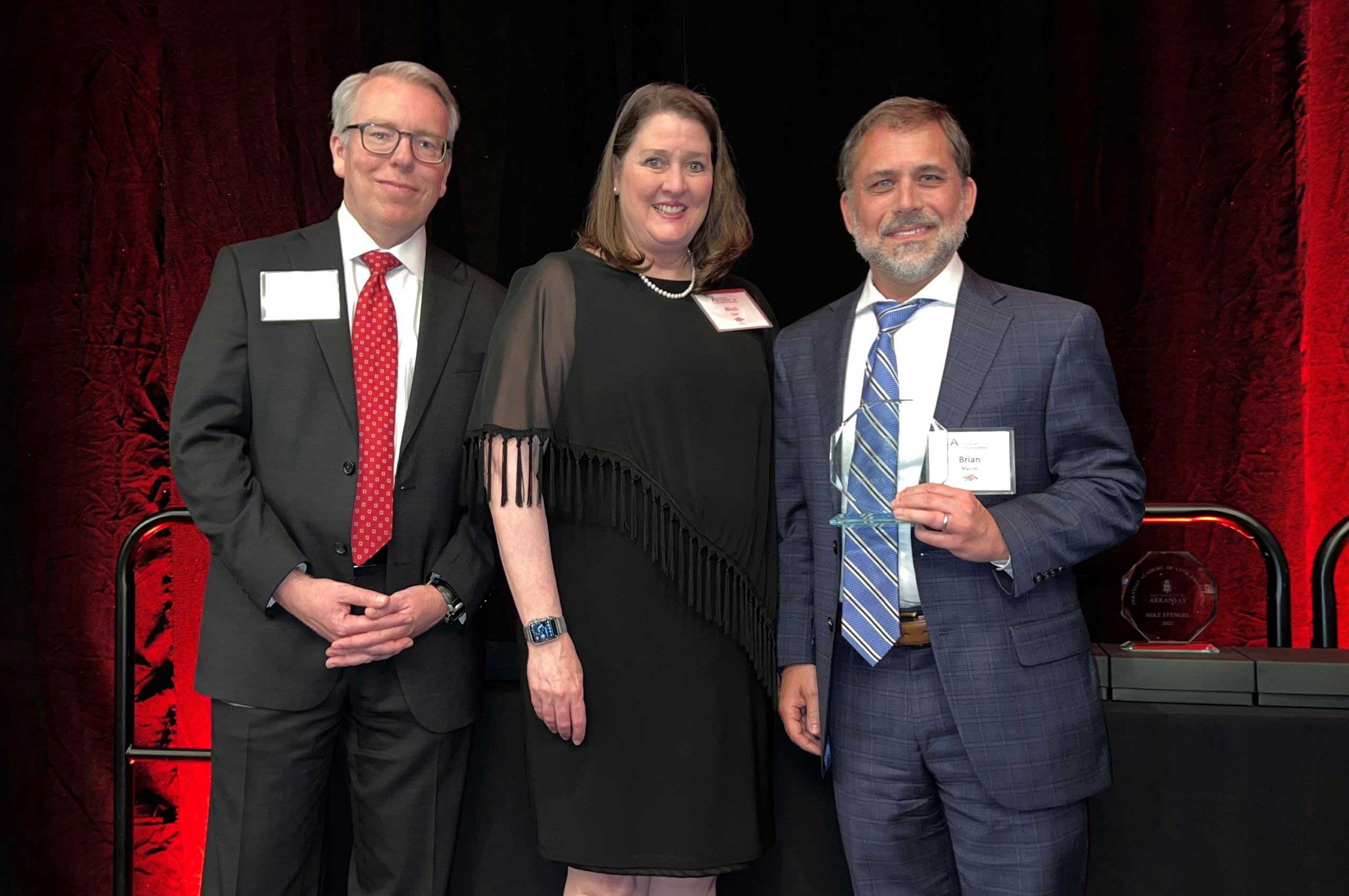 Halff's Brian Maurer standing next to officials being inducted into Arkansas Academy of Civil Engineering.