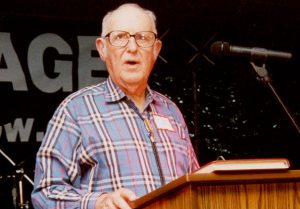 Dr. Albert H. Halff speaking at a podium